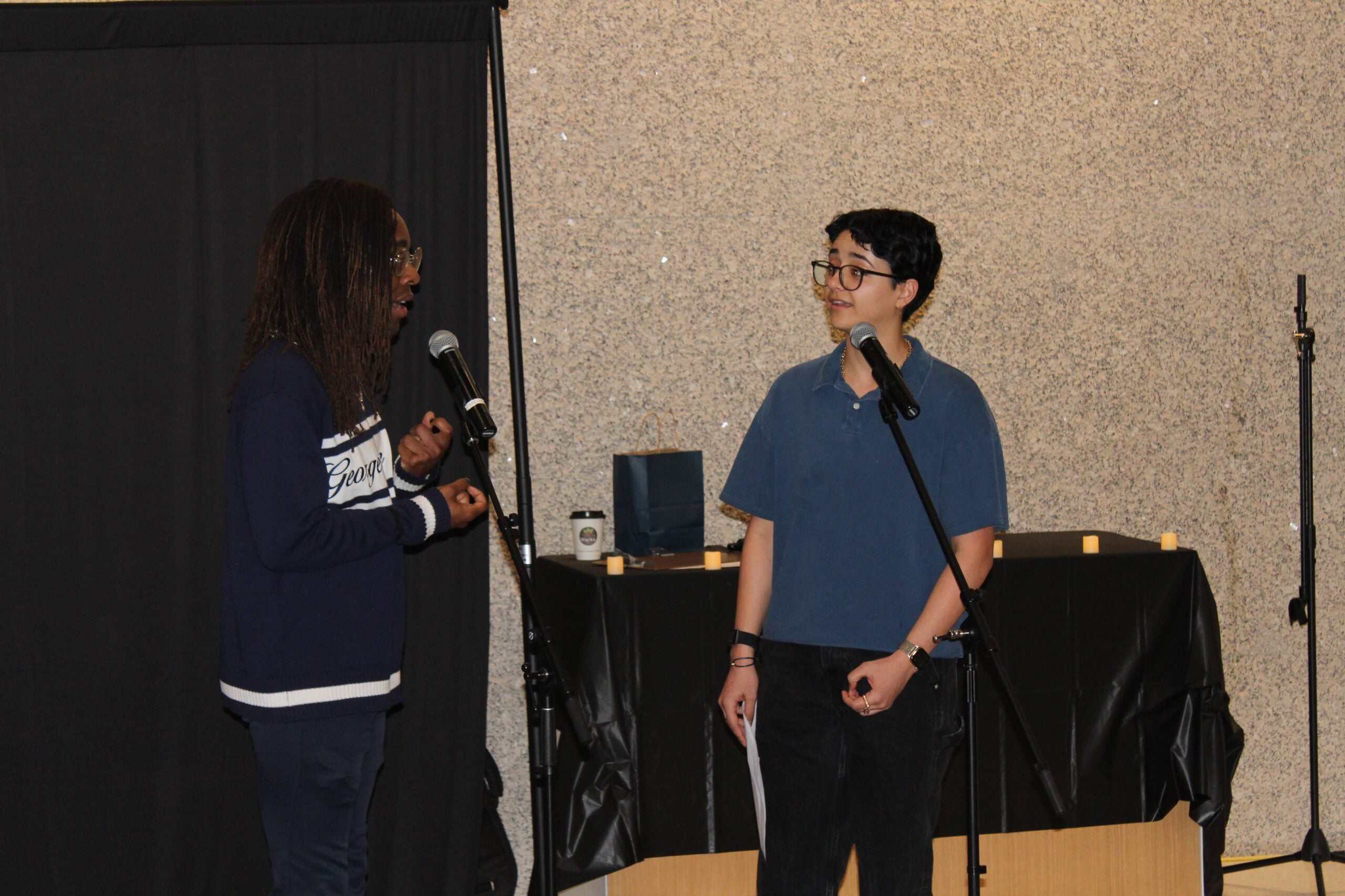 Two students performing a songs at the capitol campus open mic night event