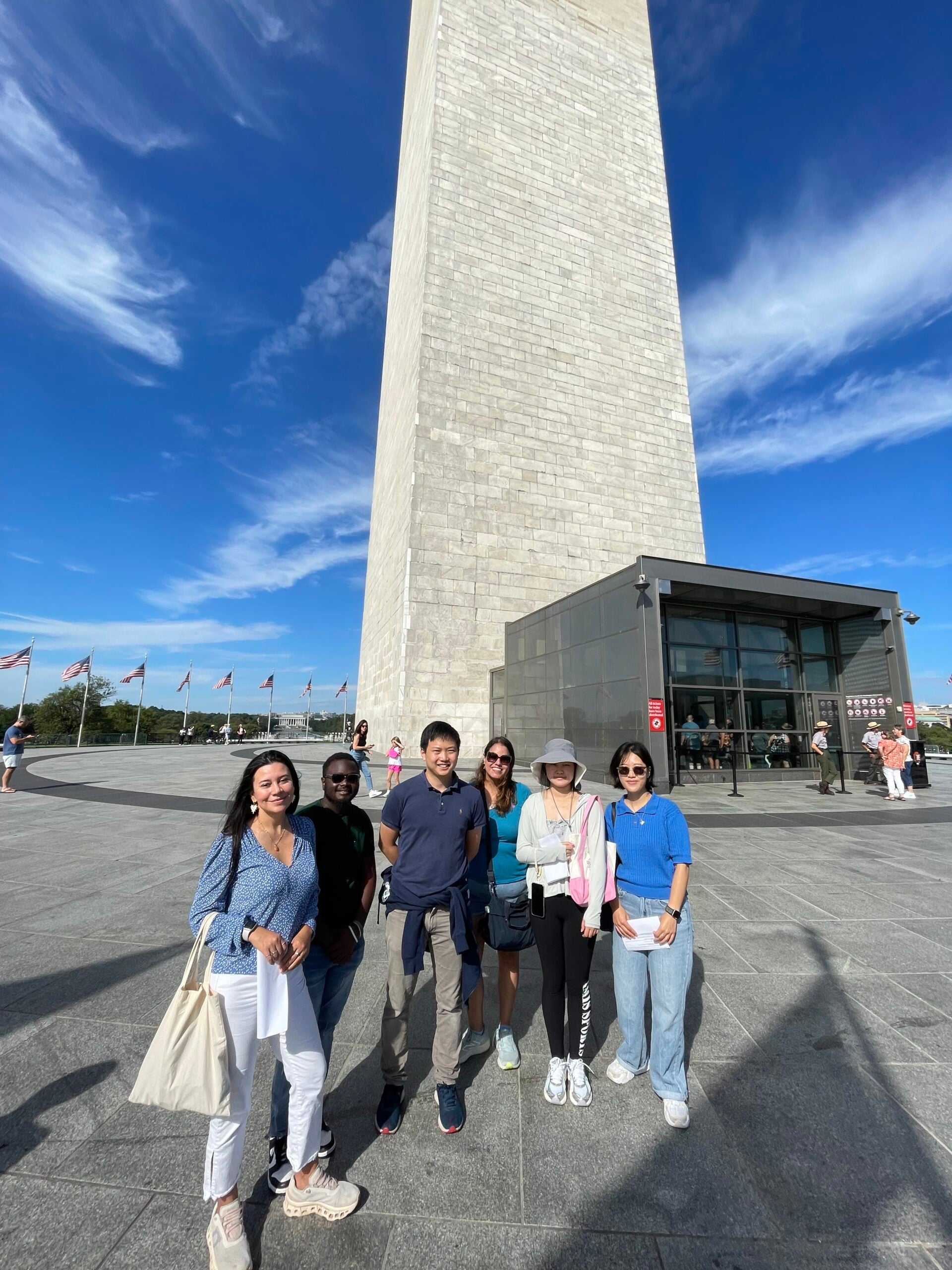 Group standing in front of the national monuments during a dc excursion trip
