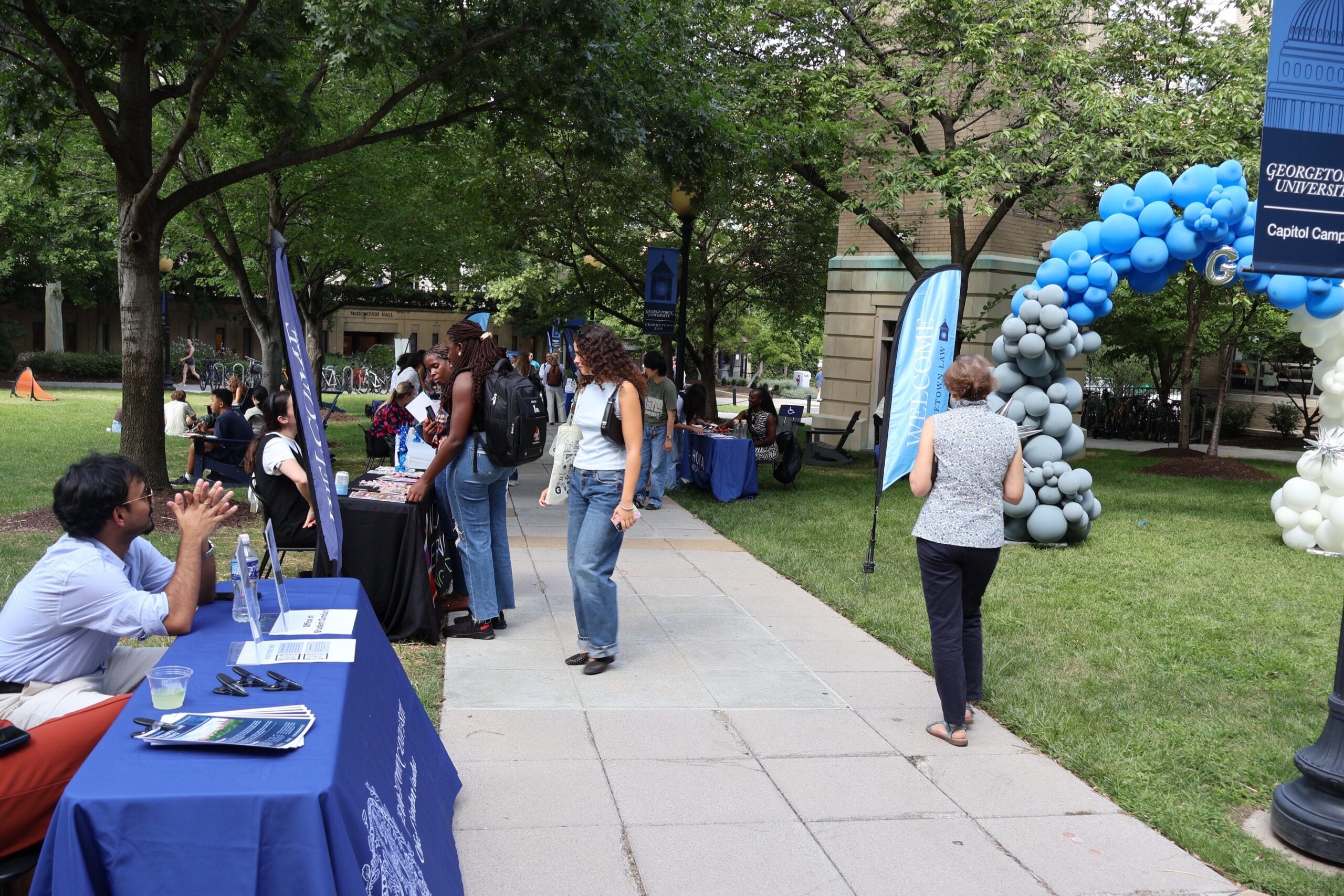 Department and student organizations speaking with students while tabling